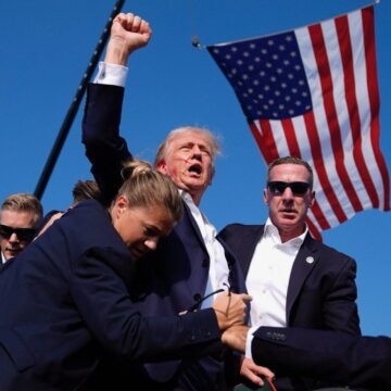 Iconic Photo: Bloodied Trump Raises Fist Post Assassination Attempt