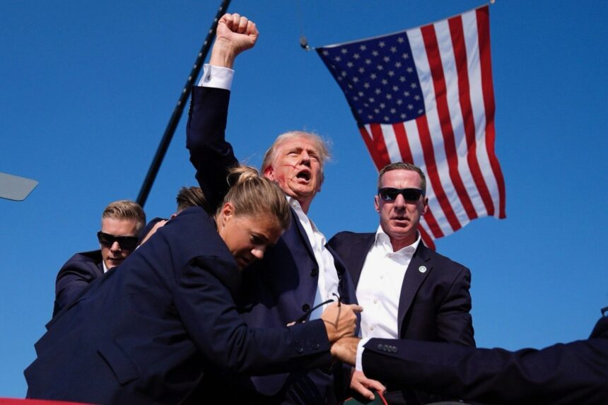 Iconic Photo: Bloodied Trump Raises Fist Post Assassination Attempt